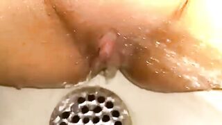 Throbbing clit orgasm in shower