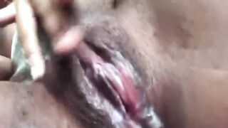 Ebony with extremely creamy pussy plays with herself